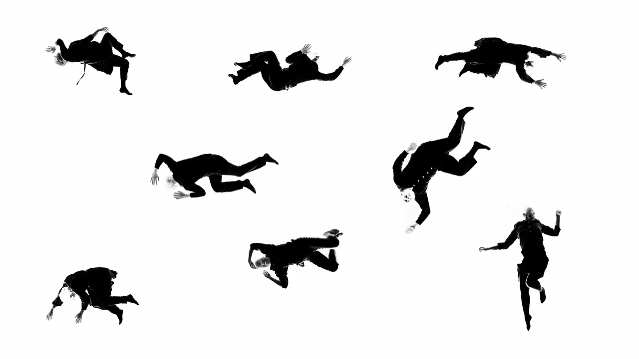 Eight bodies dressed in black lying in various positions onto a white, overlit surface