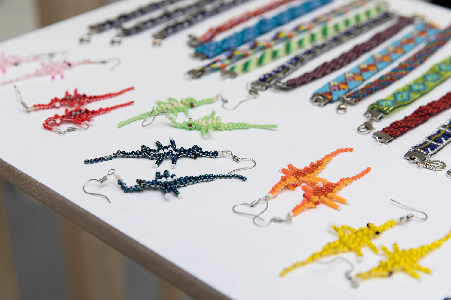 beaded bracelets and crocodile earrings of various colours