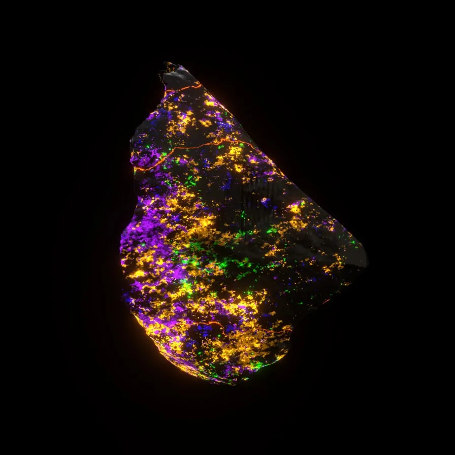 A stone-like form with numerous illuminated fluorescent spots floating against a black background